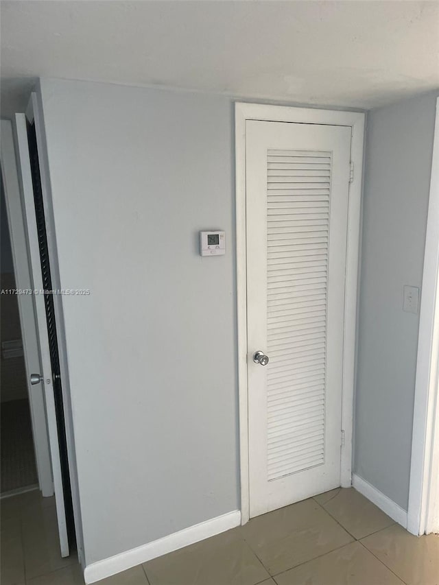 hallway featuring tile patterned floors