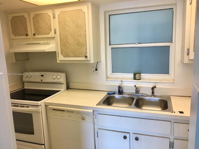 kitchen featuring sink, white appliances, and white cabinets