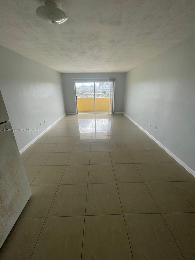 empty room featuring tile patterned floors