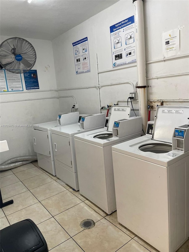 laundry room with light tile patterned floors and separate washer and dryer