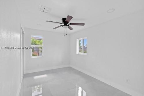 spare room with ceiling fan