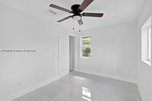 spare room with ceiling fan