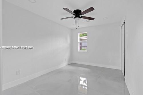 unfurnished room with ceiling fan