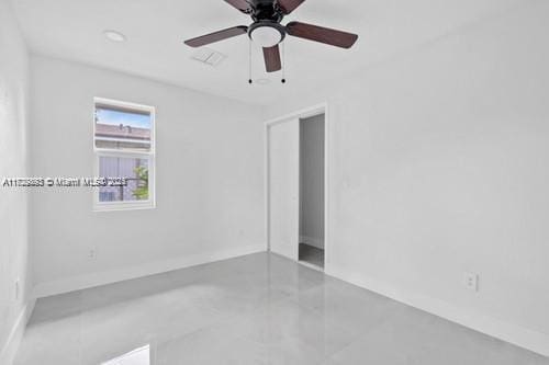 unfurnished room with ceiling fan