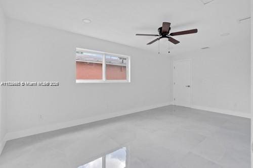 empty room featuring ceiling fan