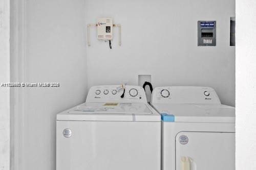 washroom with washer and clothes dryer