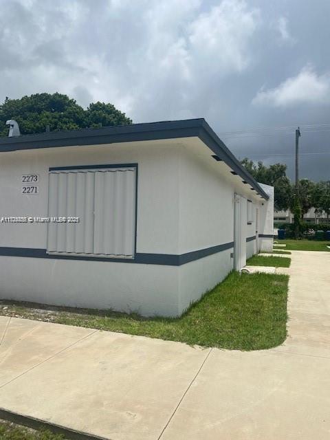 view of side of home with a patio area