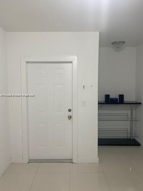 entrance foyer featuring light tile patterned floors