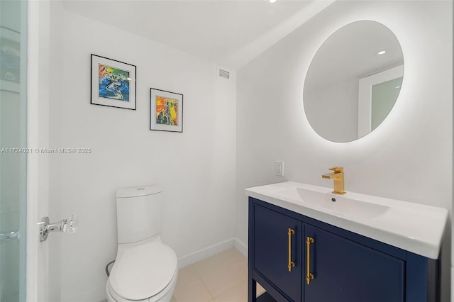 bathroom featuring vanity, toilet, and tile patterned floors