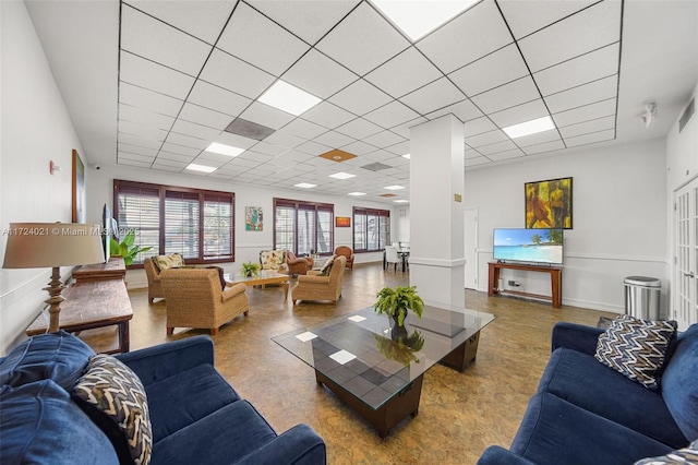 living room with a drop ceiling