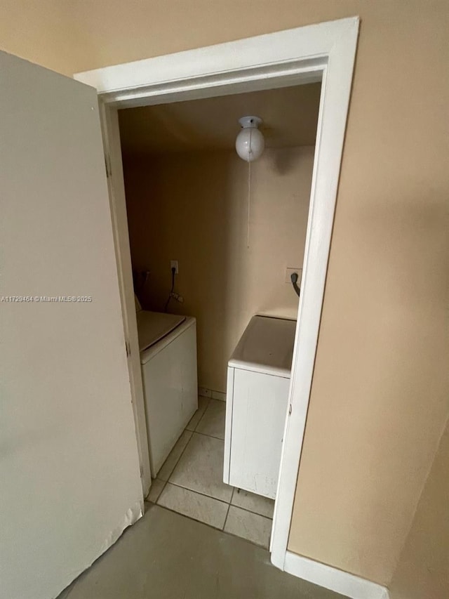 laundry area with washing machine and clothes dryer