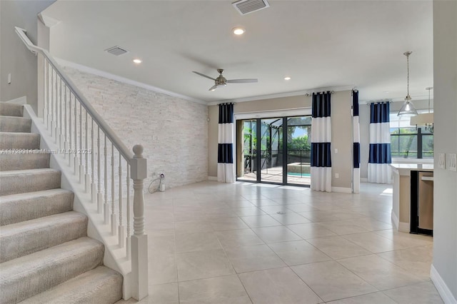 interior space featuring ceiling fan, crown molding, and light tile patterned floors