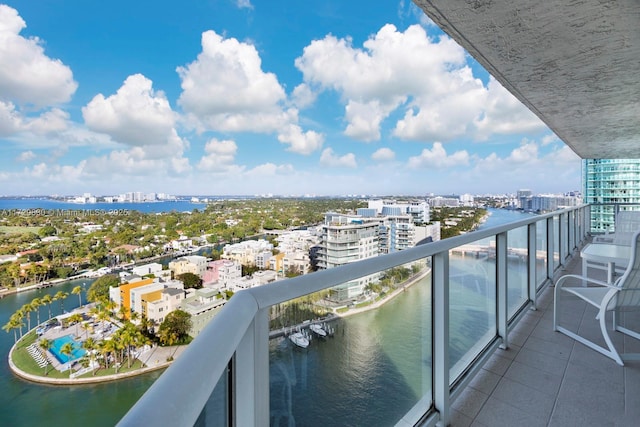 balcony featuring a water view