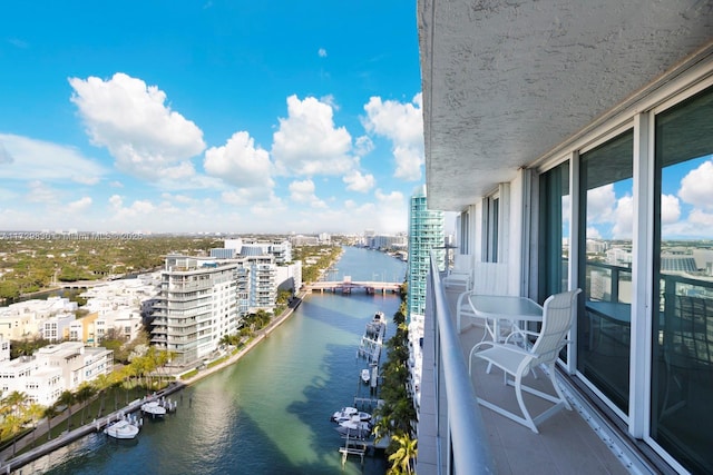 balcony featuring a water view