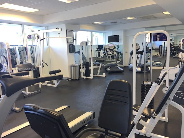 gym featuring a drop ceiling