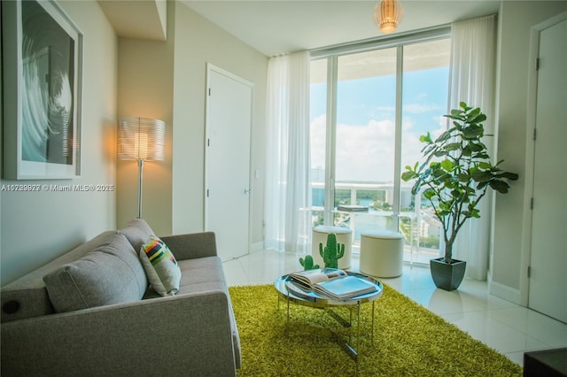 tiled living room with floor to ceiling windows