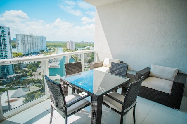 balcony featuring a water view