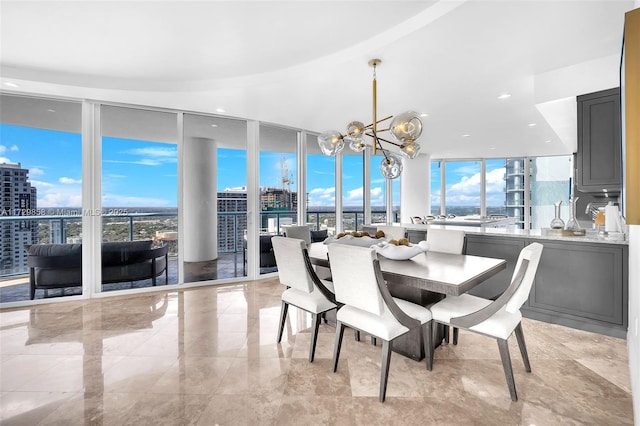 dining area with floor to ceiling windows and a chandelier