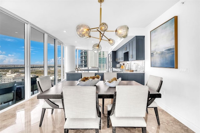 dining area with a notable chandelier and expansive windows