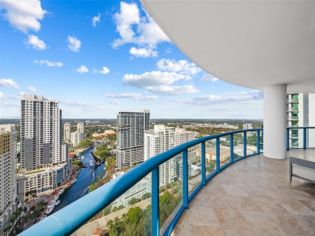 balcony featuring a water view