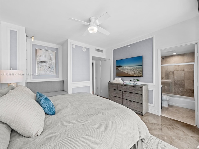 bedroom with ceiling fan and ensuite bath