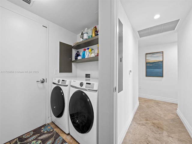 washroom featuring washing machine and dryer