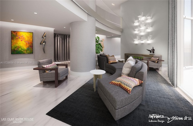 living room featuring hardwood / wood-style flooring and decorative columns