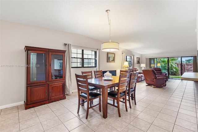 dining space with light tile patterned floors