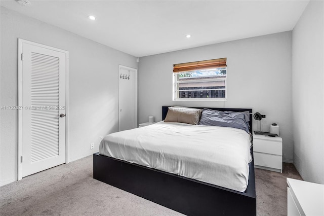 bedroom featuring light carpet