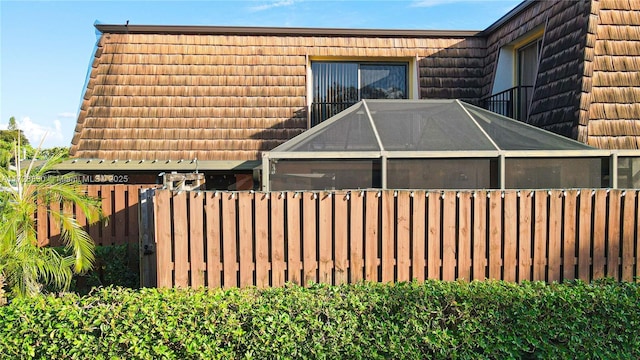 view of property exterior featuring a lanai