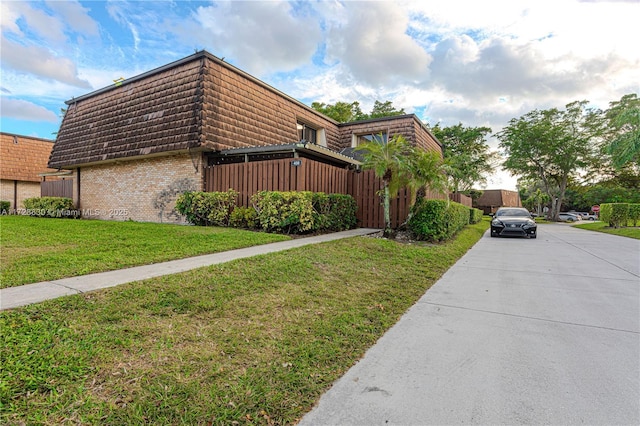 view of property exterior featuring a yard