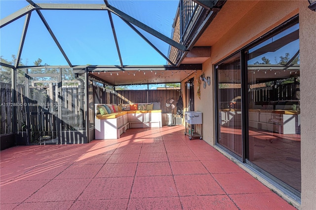 view of patio / terrace with a lanai