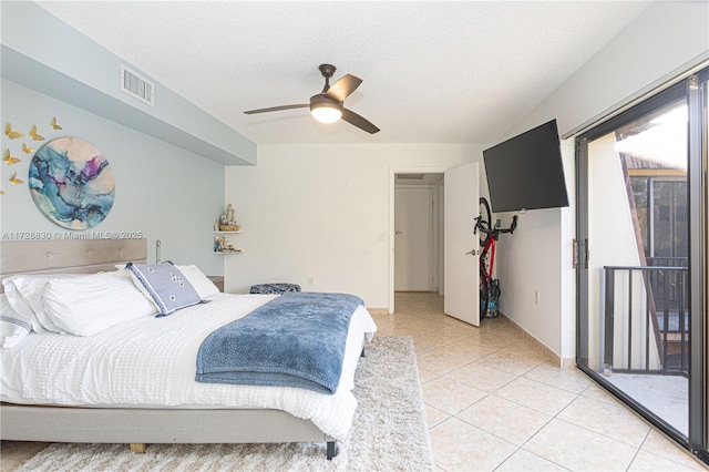 tiled bedroom with ceiling fan, a textured ceiling, and access to outside