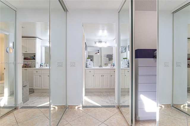 bathroom featuring tile patterned floors and vanity