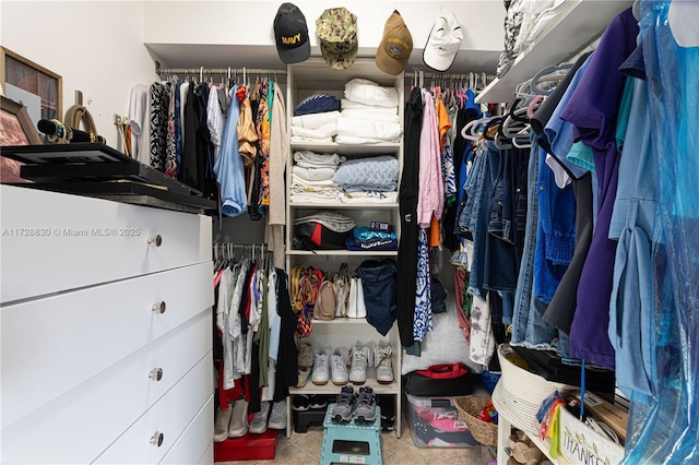 walk in closet featuring light tile patterned floors