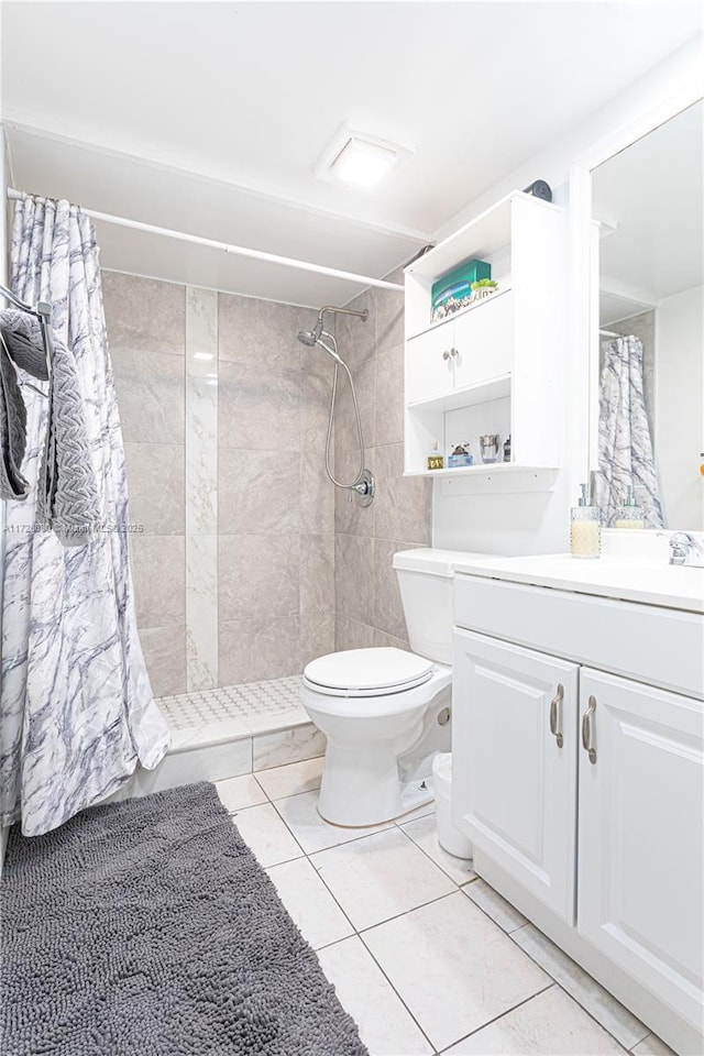 bathroom featuring a shower with curtain, toilet, tile patterned flooring, and vanity