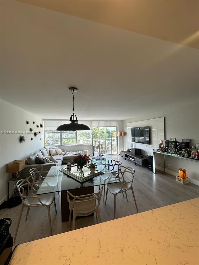 dining space featuring hardwood / wood-style flooring