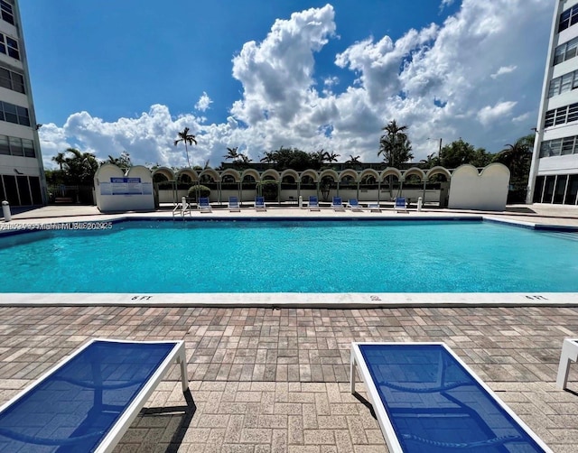 view of swimming pool with a patio area