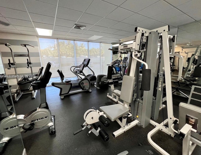 exercise room featuring expansive windows