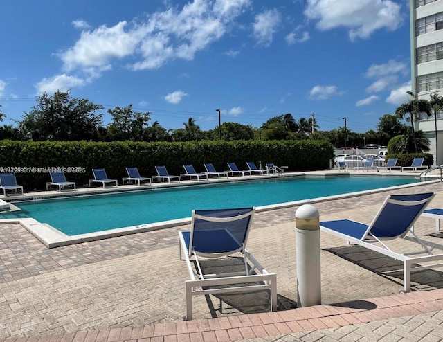 view of swimming pool featuring a patio area