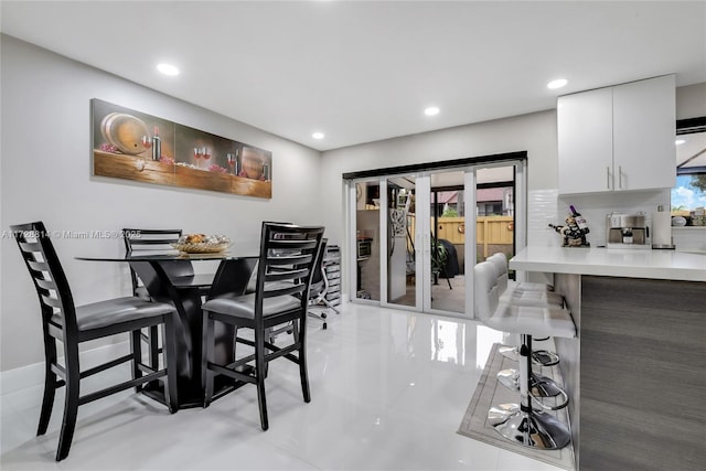 tiled dining area with a wealth of natural light