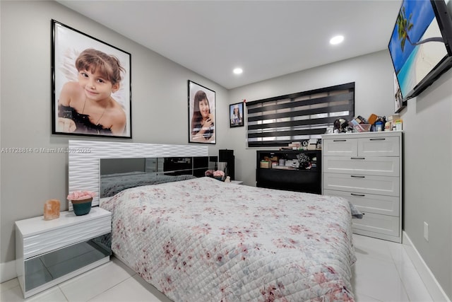 bedroom featuring light tile patterned floors