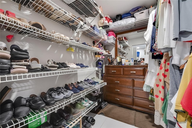 spacious closet featuring tile patterned flooring