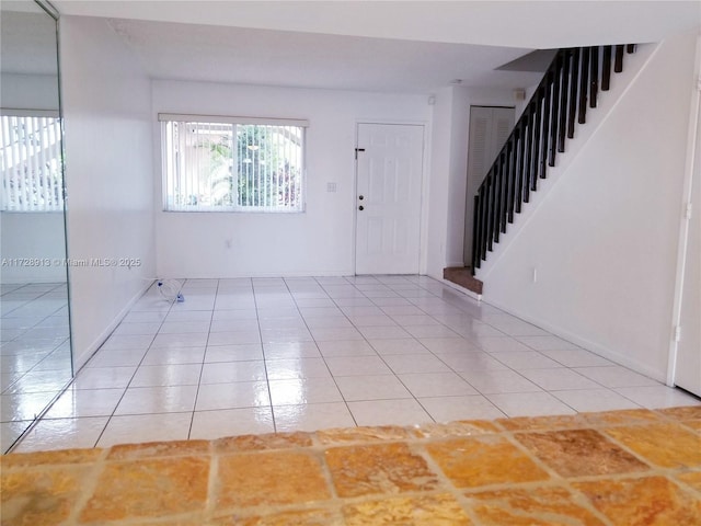 foyer entrance featuring light tile patterned floors