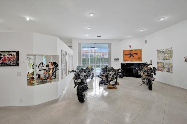 workout room featuring light tile patterned floors