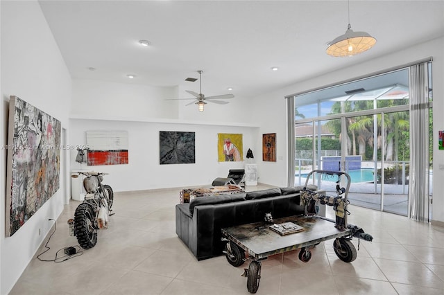 living room featuring ceiling fan and light tile patterned flooring