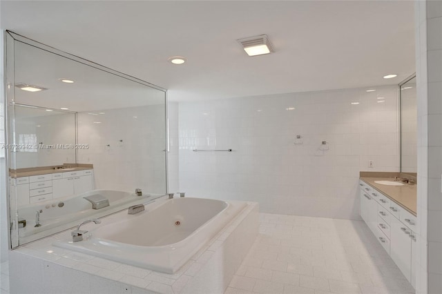 bathroom featuring vanity, tile walls, and tile patterned flooring