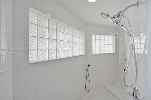 bathroom with a tile shower