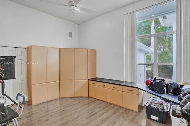 office area with ceiling fan and light wood-type flooring