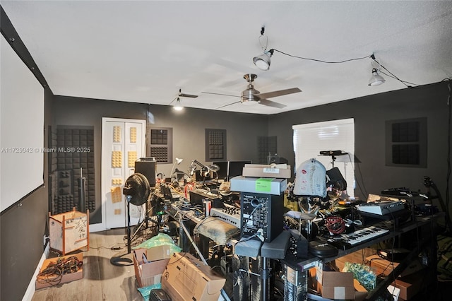 interior space with ceiling fan and hardwood / wood-style floors